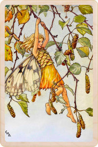 Fairy hanging from a branch with leaves in the background