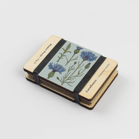 Small flower press with floral design on the front on a white background