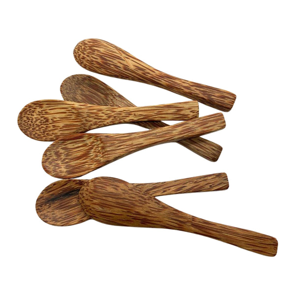 Set of wooden spoons on a white background