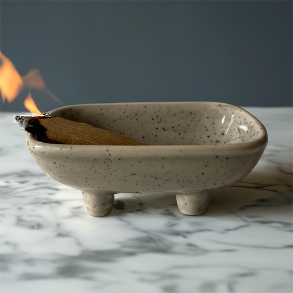 Ceramic dish for burning sage and incense on a white background