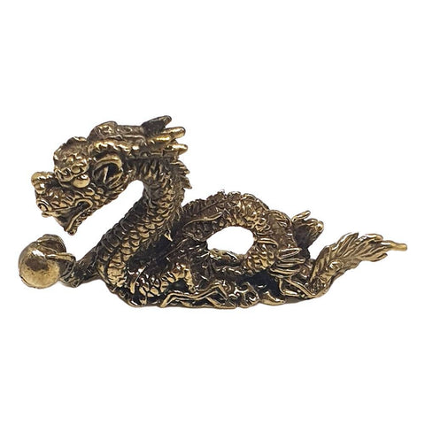 Bronze dragon figurine on a white background