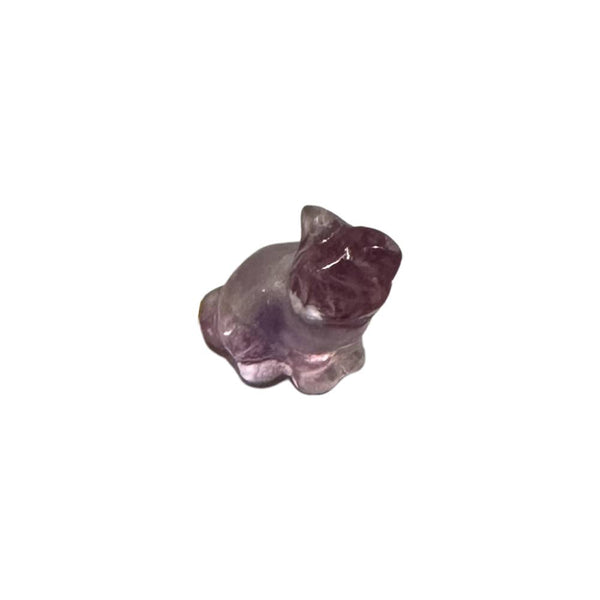 Crystal cat figurine on a white background