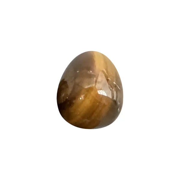 Oval-shaped tiger's eye gemstone on a white background
