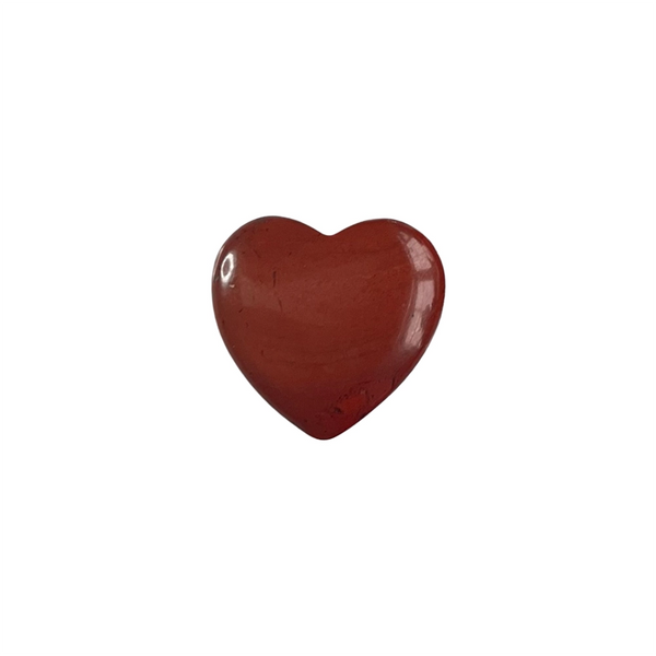 Heart-shaped red jasper gemstone on a white background