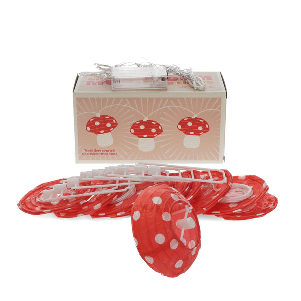 Red paper mushroom lanterns with white polka dots and a box on a white background