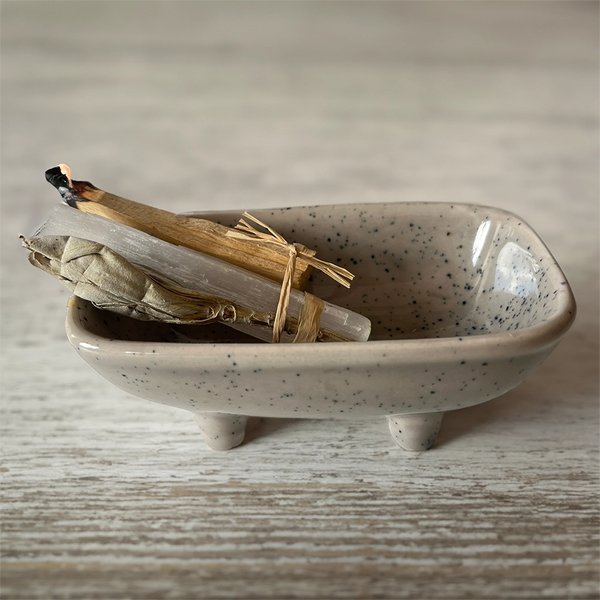 Ceramic dish for burning smudge sticks and incense on a white background