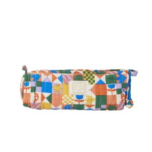 Colourful quilted pencil case on a white background