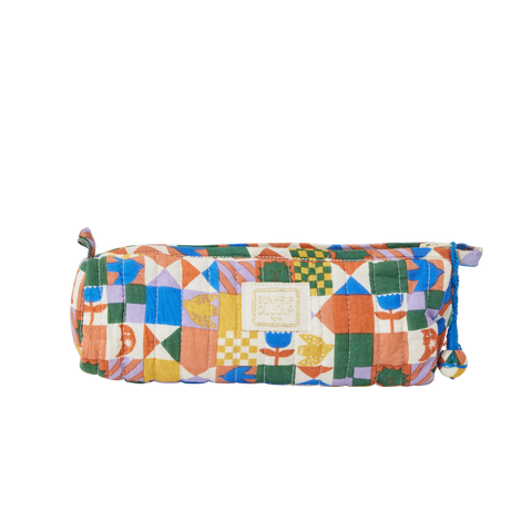 Colourful quilted pencil case on a white background
