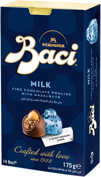 Box of Perugina Baci milk chocolate pralines with hazelnuts on a blue background.