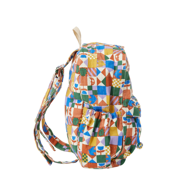 Colourful geometric-patterned backpack on a white background