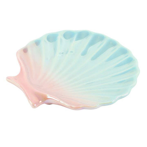 Shell-shaped dish with a pastel gradient on a white background