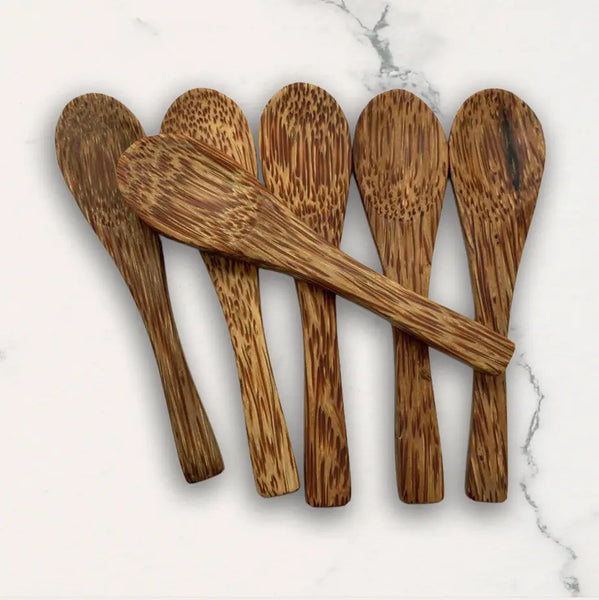 Set of wooden spoons on a marble surface