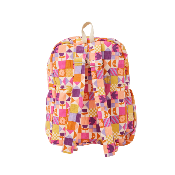 Colourful geometric-patterned backpack on a white background