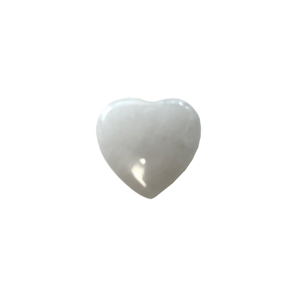 Clear Quartz heart-shaped crystal on a white background