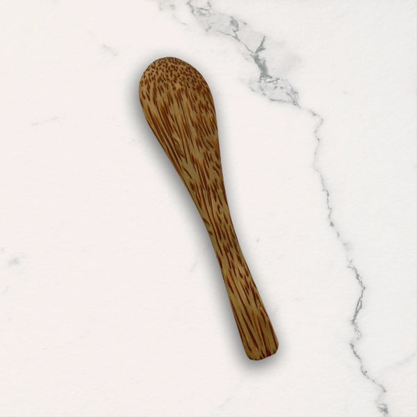 Wooden spoon on a marble surface