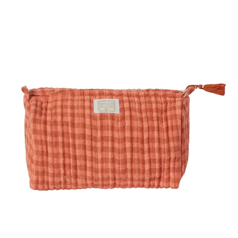 Plaid patterned pouch with a tassel on a white background