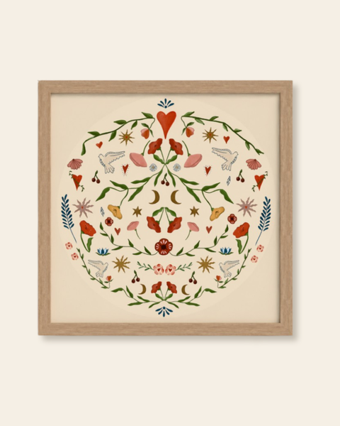 Framed artwork with a circular design of flowers and birds on a beige background