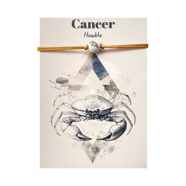 Howlite gemstone bracelet with crab design on a card labeled 'Cancer'.