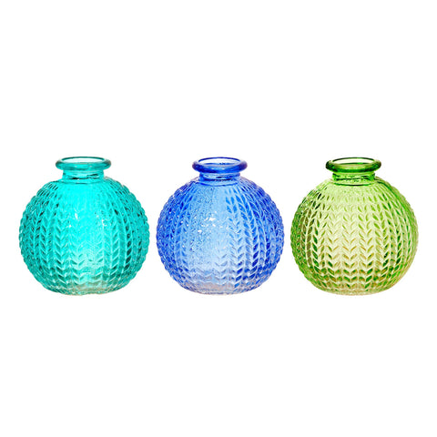 Three textured glass vases in blue, green, and turquoise on a white background