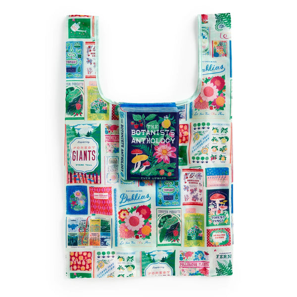 Colourful patterned tote bag with a book inside on a white background