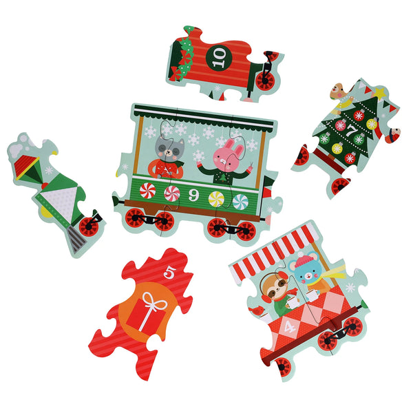 Set of Christmas-themed puzzle pieces with a train design on a white background