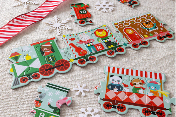 Children's train-themed puzzle with colorful pieces on a textured surface.