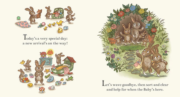 Illustrated book page with bunnies and baby announcement text on a white background