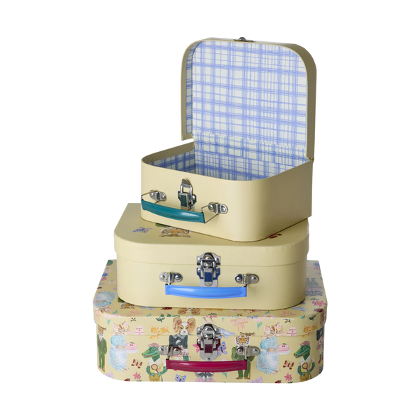 Three stacked children's suitcases with animal-themed designs on a white background