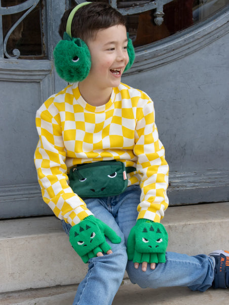 Boy wearing T-Rex bum bag and accessories