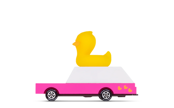 Yellow duck on a pink truck with white roof on a white background