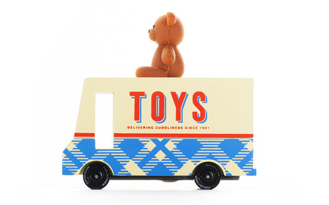 Toy truck with a teddy bear on top against a white background