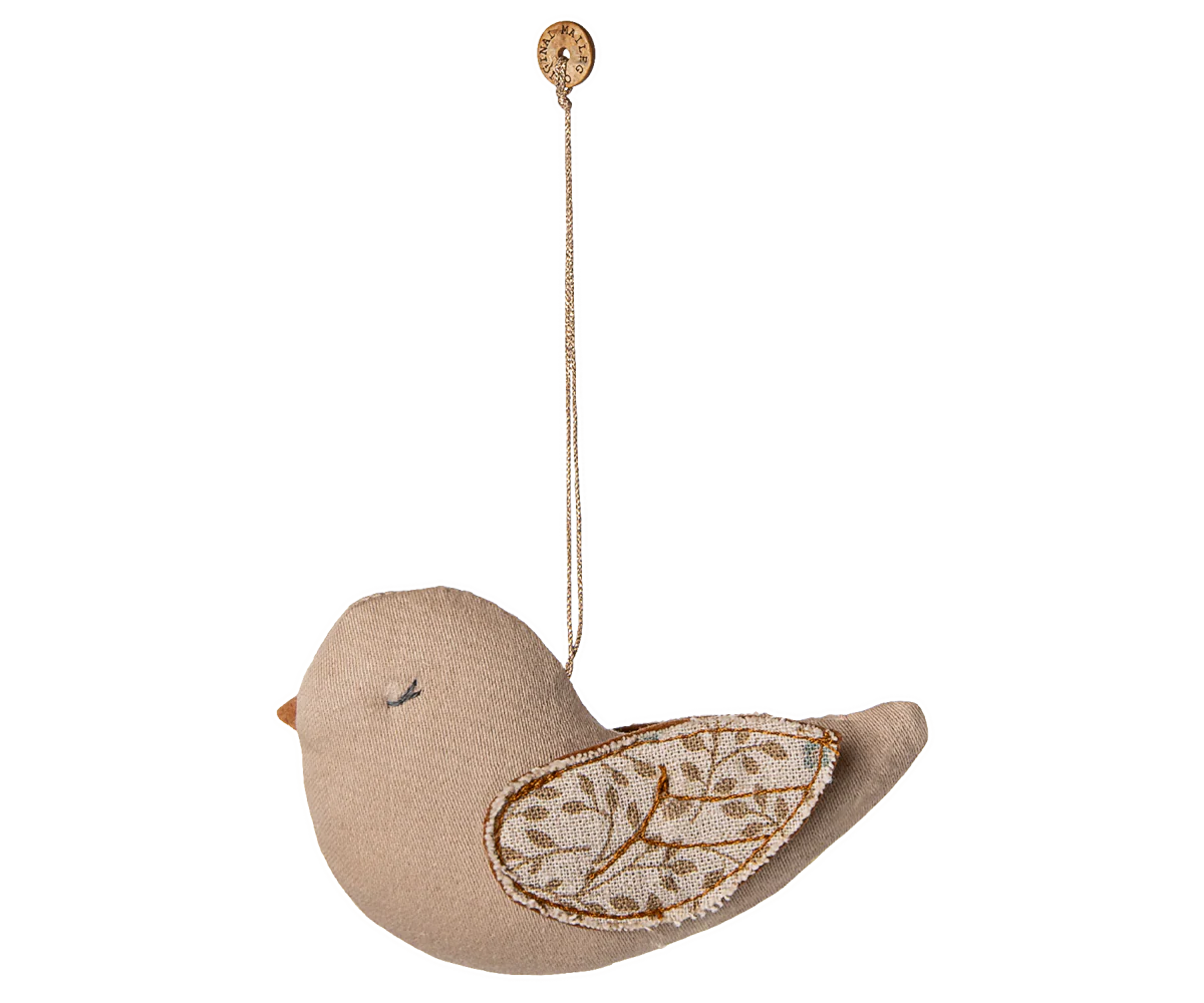 Decorative bird ornament with tree branch detail on a white background
