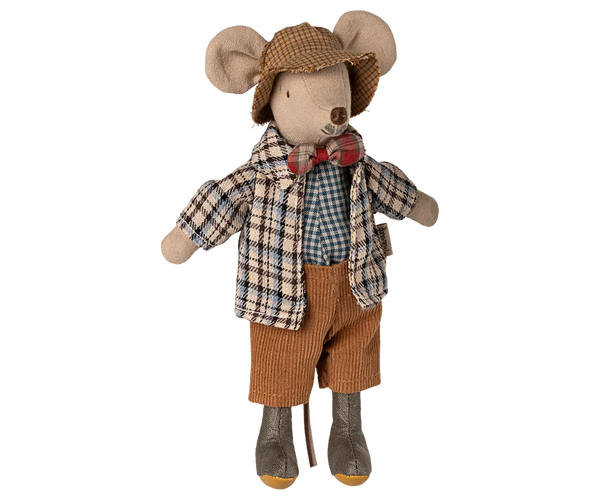 Stuffed toy mouse dressed in a plaid shirt, bow tie, and brown pants on a white background