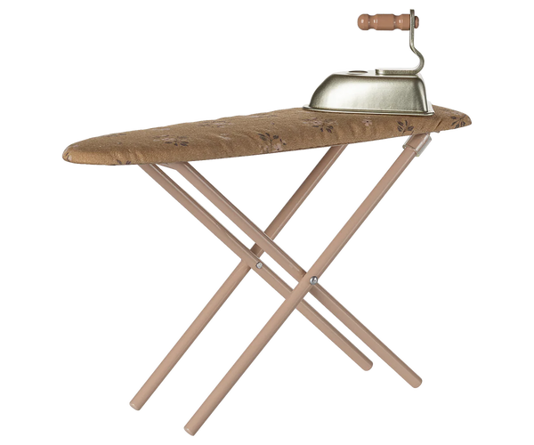 Metal ironing board with a metal iron on a white background