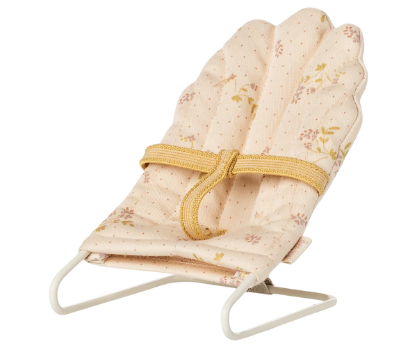 Off White babysitter for a toy baby rabbit against a white background