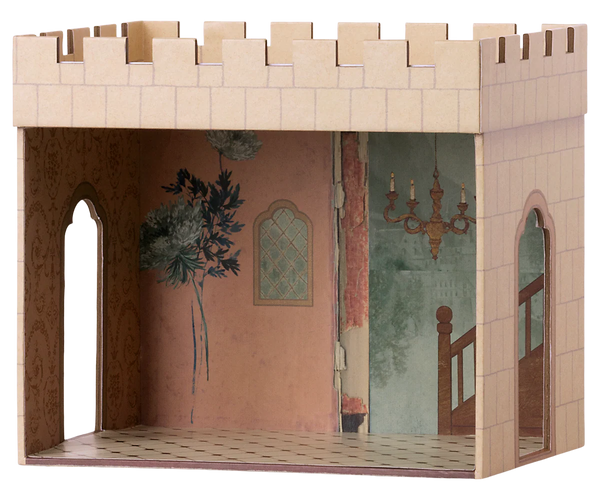 Cardboard dollhouse room with decorative interior walls and illustrated chandelier.