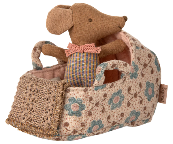 Stuffed mouse toy with a floral-patterned bag on a white background