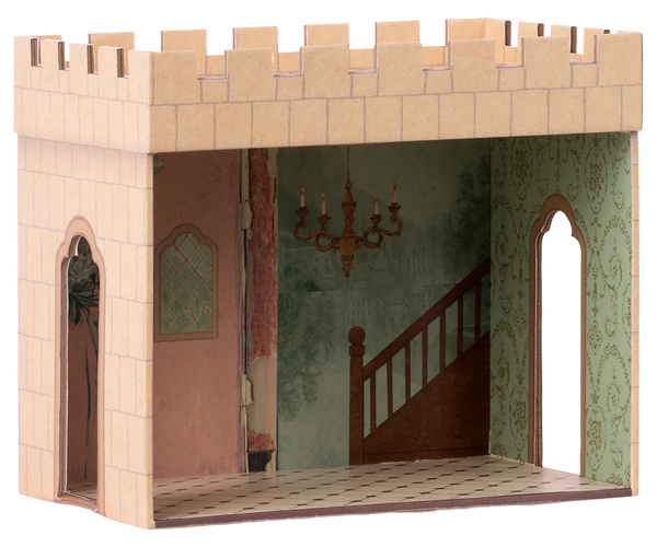 Cardboard dollhouse room with castle design featuring a staircase and chandelier.