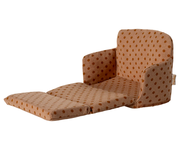 Brown polka dot chair on a white background