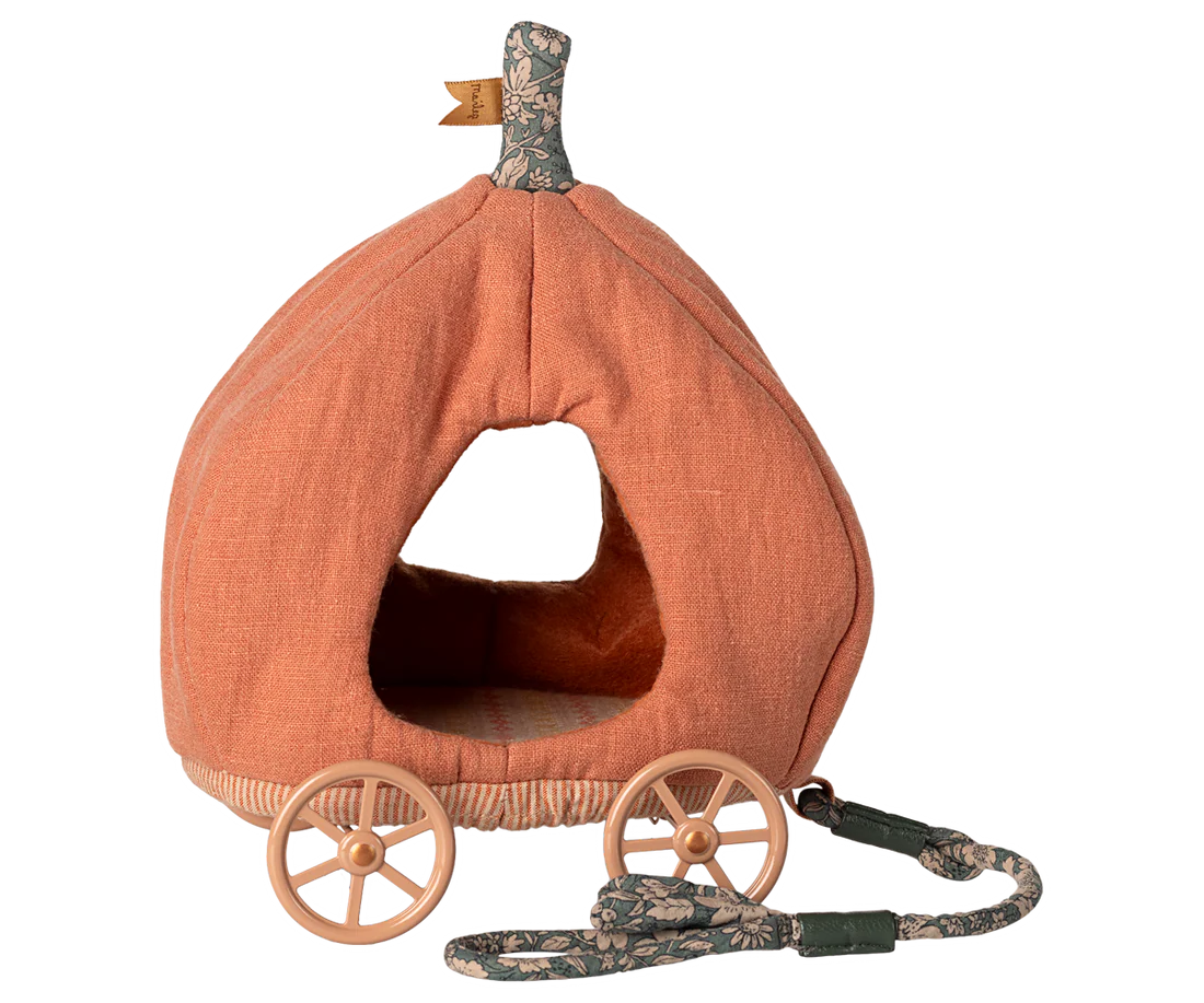 Pumpkin-shaped fabric carriage with wheels and a handle on a white background