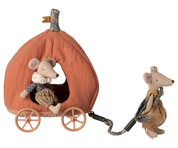 Toy mouse with a pumpkin carriage on a white background
