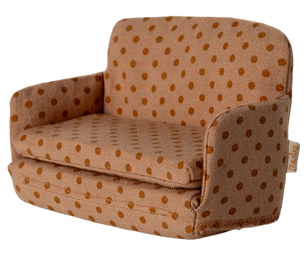 Children's armchair with brown polka dot pattern on a white background