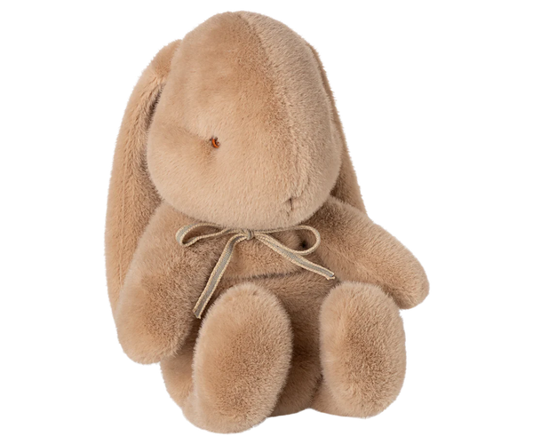 beige plush bunny toy on a white background