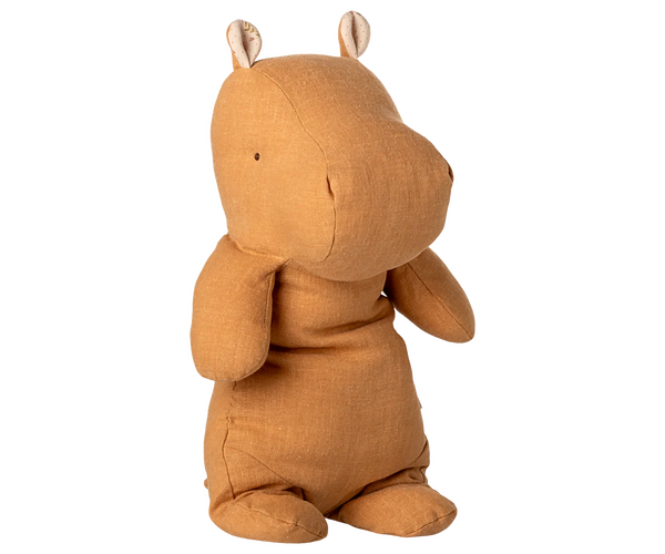 Honey plush hippo toy on a white background