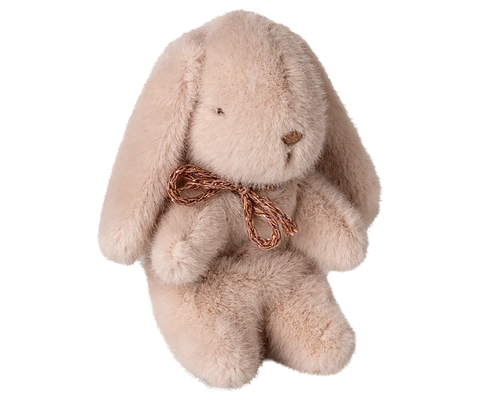 Plush pink bunny toy with a brown bow on a white background