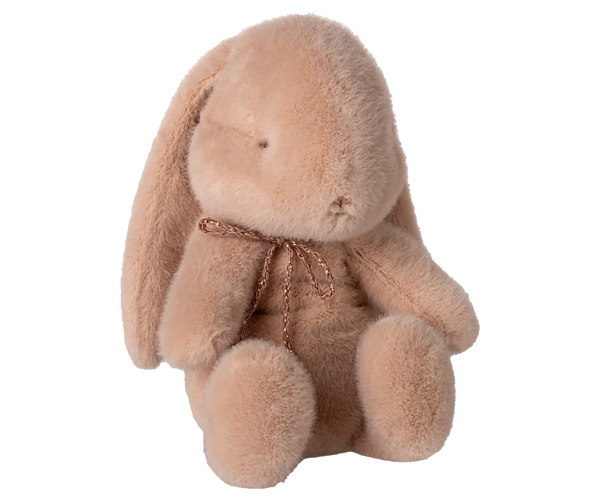 Pink plush bunny soft toy with a bow around its neck