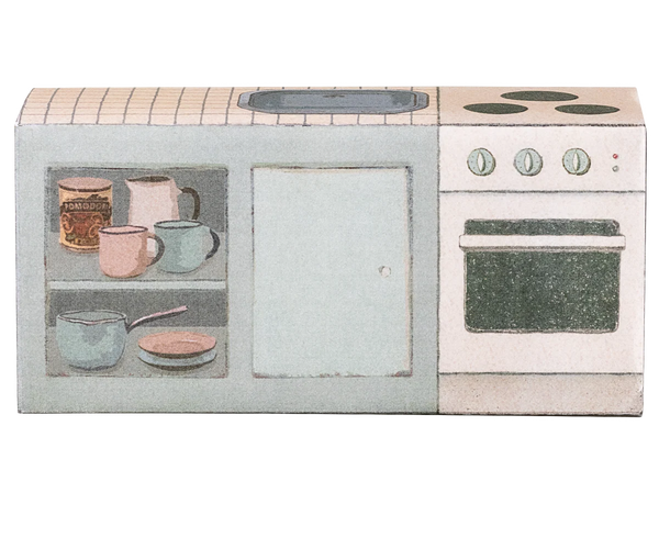 Cardboard toy kitchen counter with illustrated pots and pans on a white background