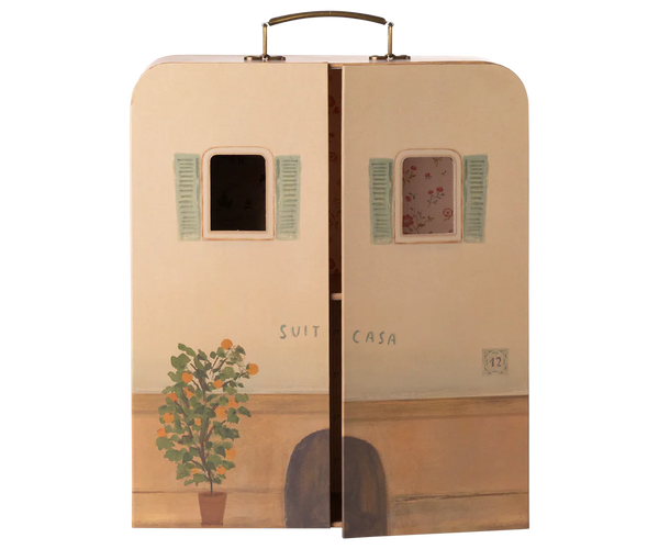Decorative suitcase dollshouse with artistic design on a white background