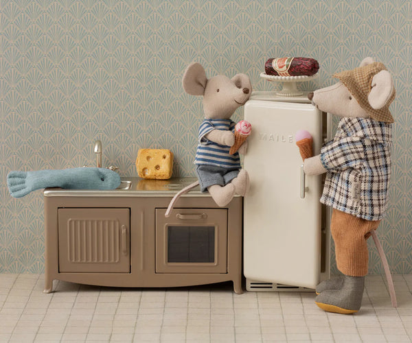 Soft toy mice in a dolls house kitchen setup
