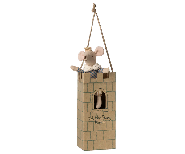 Stuffed mouse in a small castle toy on a white background